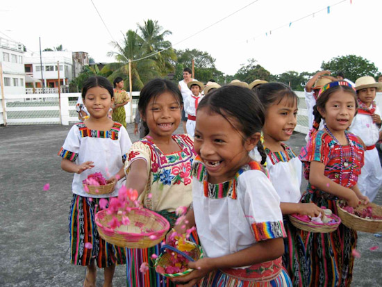 Guatemalan school children dance to celebrate the arrival of the surgical team.